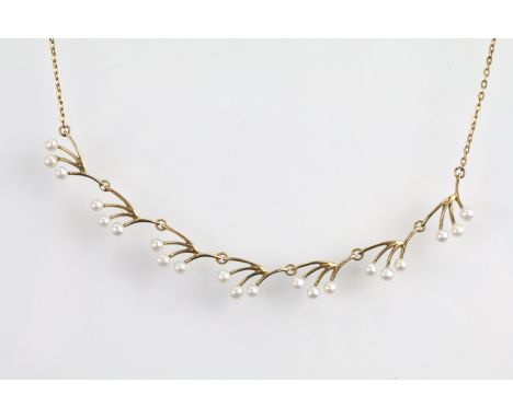 9ct gold and pearl collar necklace with seven branch sections each set with three pearls suspended from a fine link chain wit