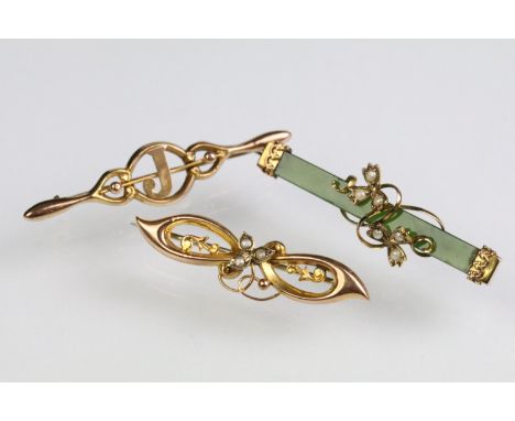 Three early 20th Century Edwardian 9ct gold bar brooches to include a nephrite example with seed pearl set floral details, a 
