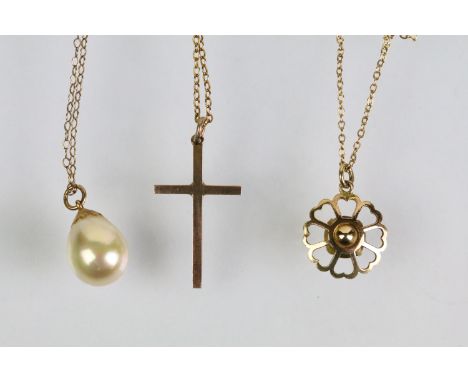 Three pendant necklaces to include a 9ct gold cross pendant (marked 9ct to pendant and chain), 9ct gold purple stone pendant 