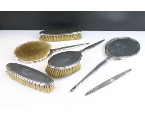 Art Deco silver hallmarked dressing table set consisting of mirror, two hair brushes and two clothes brushes with engine turn