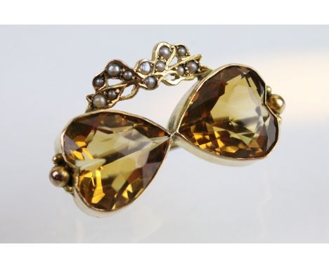 19th Century Victorian 9ct gold, citrine and seed pearl double heart brooch. The brooch being set with two heart cut citrines
