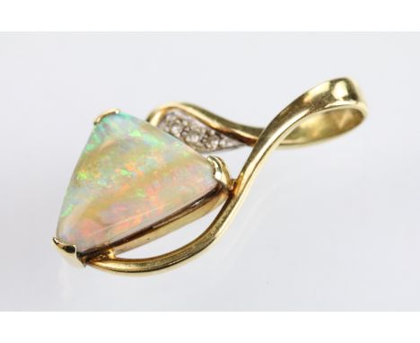 18ct gold opal and diamond pendant being set with a polished triangular opal displaying a full spectrum of colour with three 