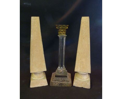 A Glass Candlestick of Corinthian Form with Brass Mount, together with a pair of terracotta square tapering obelisk