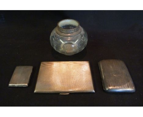 A Birmingham Silver Cigarette Case, together with two other similar and a silver mounted cut glass dressing table jar