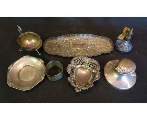 A Silver Embossed Pin Tray, together with a silver capstan inkwell, a silver jug, two silver dishes, a napkin ring and a glas