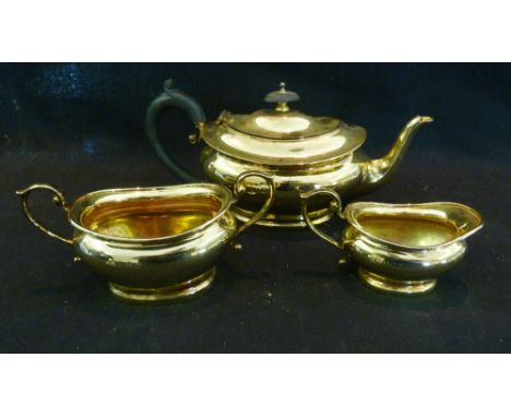 A Birmingham Silver Gilt Three Piece Tea Service, comprising teapot, sucrier and cream jug, 19 ozs.