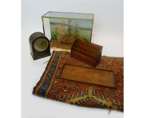 A Model of a Three Masted Man O War, within glazed case, together with a dome shaped mantle clock, a rug and two stationery t