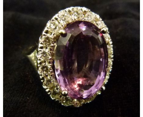 An 18ct. White Gold Amethyst and Diamond Ring, with central amethyst surrounded by diamonds, diamonds approximately 1.91ct. a