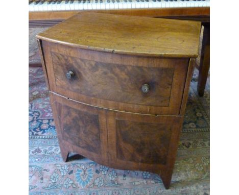 A George III Mahogany Commode, with a hinged top raised upon bracket feet