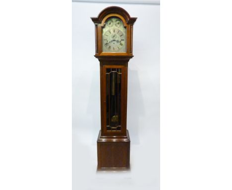 An Edwardian Mahogany Longcase Clock, the silvered dial with three train musical movement with Westminster, Winchester and  W