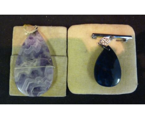 An Oval Amethyst Pendant, together with another similar pendant