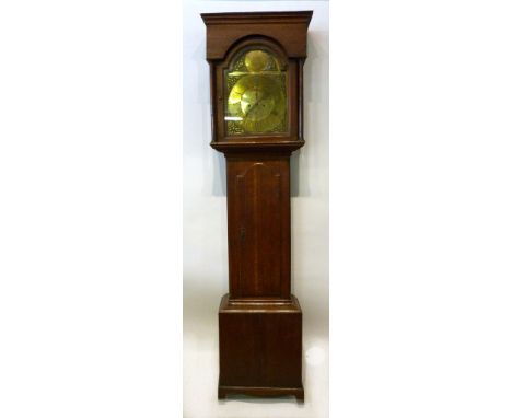 A George III Oak Longcase Clock, the arched hood with turned pilasters above a rectangular door and conforming plinth base, t