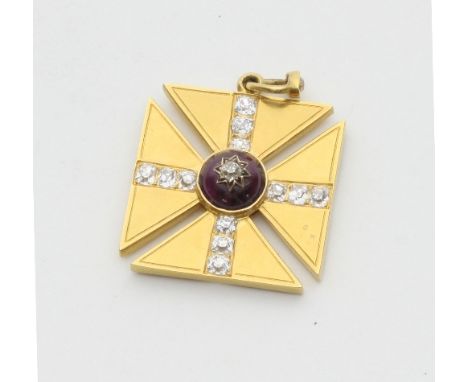 A gold, diamond and garnet Maltese cross, the central cabochon garnet with a diamond set star inset, within four rows of thre