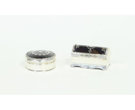 A silver and tortoiseshell trinket box, William Comyns, London 1911, of casket shape, the domed tortoiseshell cover inlaid si