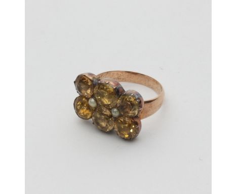 A citrine and pearl ring, made from a 19th Century brooch, the two rows of three citrines interspersed by two seed pearls