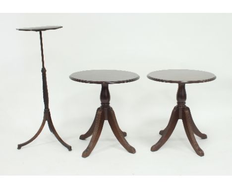 An adjustable tripod table, the octagonal tilt-top on twisted column on three outswept legs, 36cm wide, (alterations) and fou