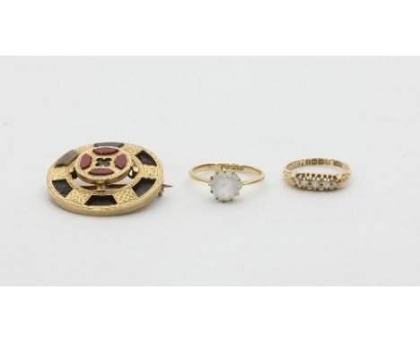 A Scottish hardstone brooch, (losses), a five-stone diamond ring set in 18ct gold and a paste set solitaire ring