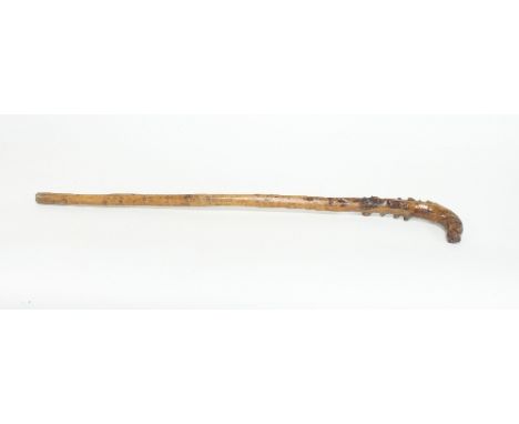 A walking stick, the handle in the form of a pointer, 85cm long