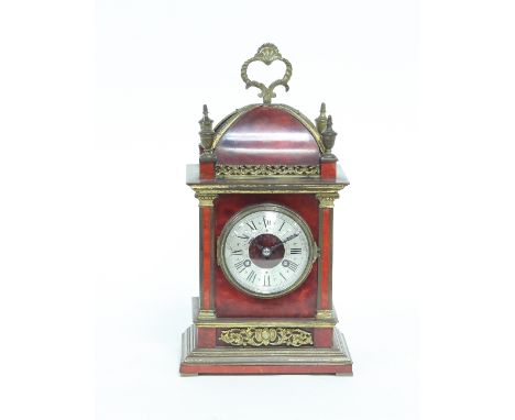 A tortioseshell mantel clock, of 18th Century design, gilt metal mounted and fitted an eight-day movement striking on a bell,