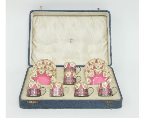 A Royal Worcester coffee set, the cans with silver mounts, circa 1924, the mounts Birmingham 1924, decorated in pink and crea