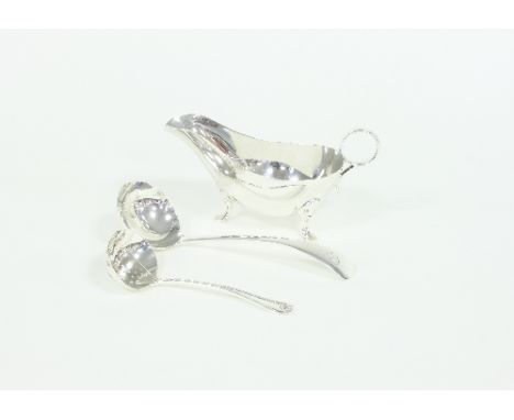 A silver mint sauce boat, J D & S, Sheffield 1929, a mint sauce ladle and another ladle, approximately 230gm