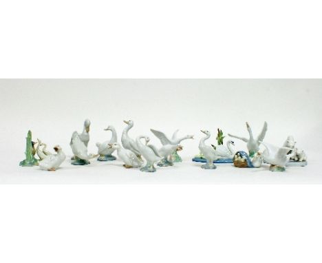 A collection of six Nao ceramic geese, some with boxes and nine Lladro figures including geese, swans and a polar bear group,