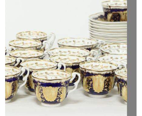 A 19th Century porcelain tea set, possibly Coalport, comprising twenty one cups, twelve saucers, a slop bowl and two bread pl