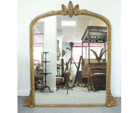 A Victorian gilt plaster framed pier glass, the arch-top applied ferns in relief, 122cm x 99cm