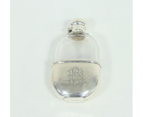 A silver mounted glass spirit flask, the mounts Mappin & Webb, Sheffield 1899, the bayonet cover and pull-off cup each with G