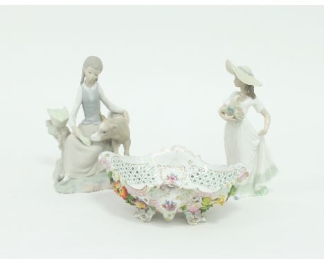 Two Lladro porcelain figures, a girl with calf, 21.5cm high, a girl with a flower basket, 22.75cm high and a German flower en