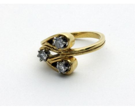 A diamond ring of modern design, set in 18ct gold, maker GEP, set with three diamonds 