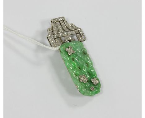 A Cartier style jade and diamond clip, the carved jade 'tree' with diamond set flowerheads, modelled standing in a stylised v