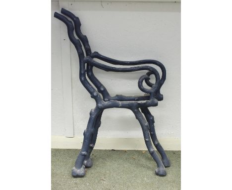 A pair of iron garden bench ends, painted green, 87cm wide