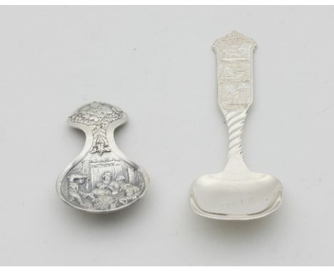 A Norwegian white metal caddy spoon with decorative handle and a Dutch caddy spoon embossed a tavern scene