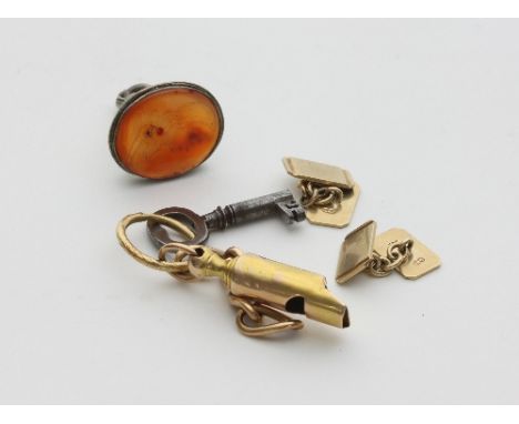 A pair of 9ct gold cufflinks, of rectangular shape, approximately 6gm, a late 19th Century gold whistle on a gold ring, a par