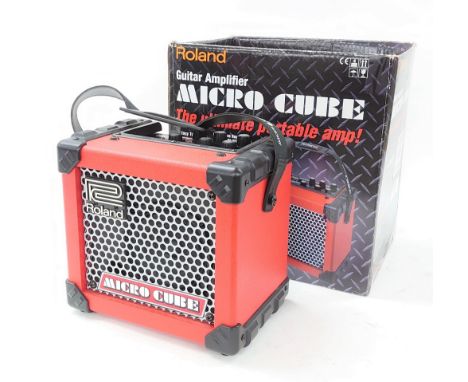 Roland Micro Cube portable guitar amplifier, with box and power lead