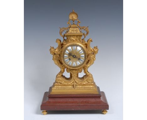 A 19th century French ormolu mantel clock, 8cm dial inscribed with Roman numerals upon enamel cartouches, twin winding holes,