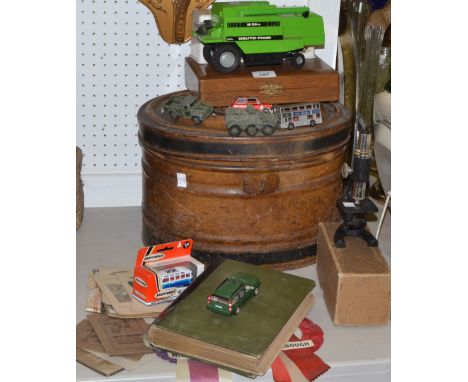A 1975 Wembley rosette, Matlock Football Assoc Cup; another Scarborough; a child's microscope ; a tin hat box; model vehicles