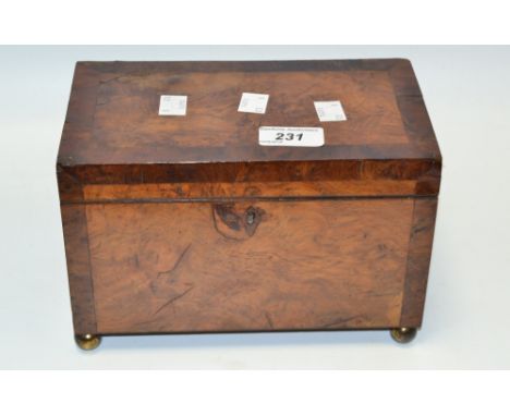 A George III  burr walnut tea caddy, the interior with two lidded compartments, brass ball feet, c.1810