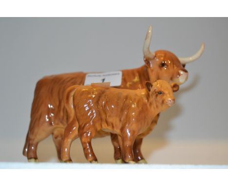 A Beswick Highland cow, model No. 1740;  a similar calf (2)