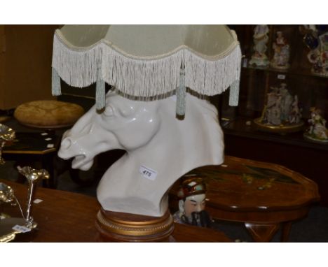 A 20th century horses head lamp base, white glaze, 34cm high