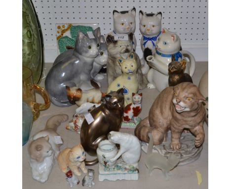 Feline Models - a Nao model of a reclining cat; a 19th century novelty cat spill holder; others, including bisque porcelain, 