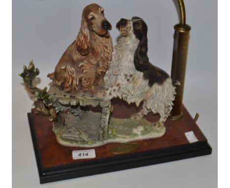 Giuseppe Armani after, a resin lamp base, "Please Play", models with Spaniels, 30cm high 