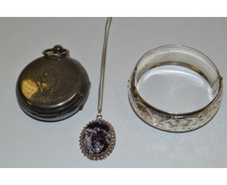 A silver hinged bangle;  a silver open faced pocket watch case;  etc 