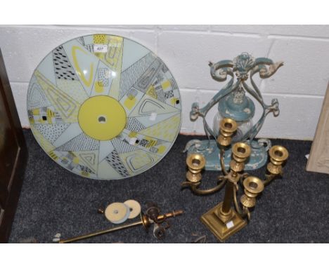 Lighting  - a glass ceiling up lighter; a brass four light candelabrum,  a storm lantern (3) 