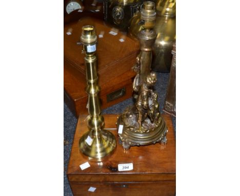 A brass figural table lamp; another; a Victorian mahogany writing slope c. 19th century (3)