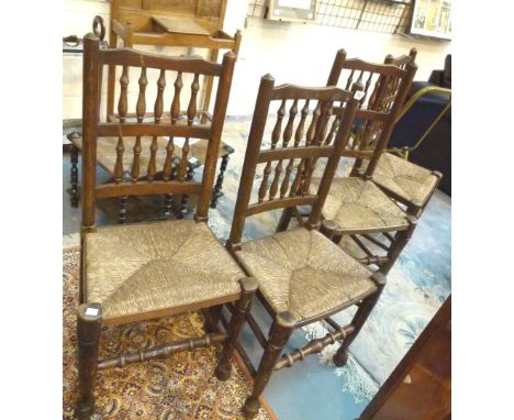 Set of four antique rush seated chairs with turned stretchers and turned stick backs