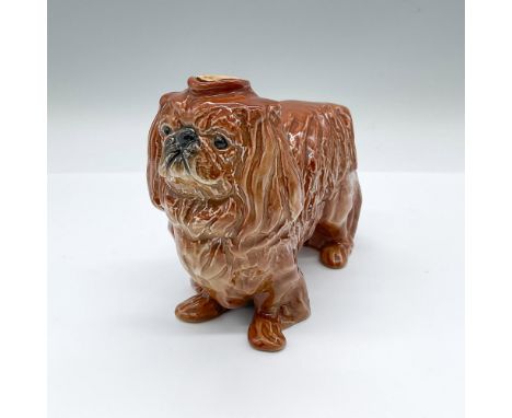 Made for Erven Lucas Bols Distillers in Amsterdam, a container formed as a dog. Hand painted brown glaze with black accents f