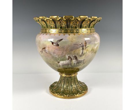 An exquisitely hand painted footed jardiniere of a duck hunting scene with green gilded ruffle rim and base. Gloss finish. Si