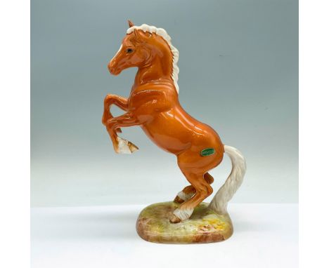 The first version glossy figure of a horse in a palomino colorway. Beswick impressed on the underside. Artist: Arthur Greding